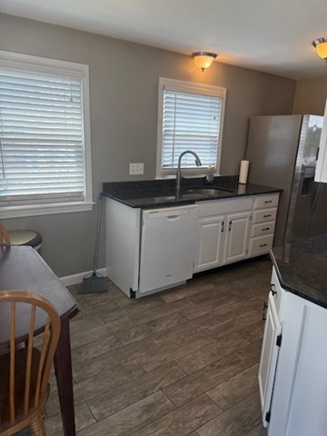 22 Forest Street, Unit 1 Ayer, MA 01432 - Photo 7 of 14 a kitchen with granite countertop white cabinets and sink