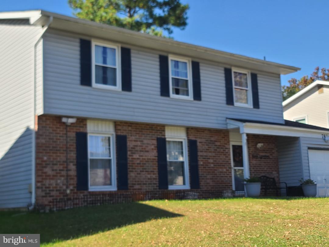 7834 Citadel Drive Severn, MD 21144 - Photo 2 of 58 a front view of a house with a yard