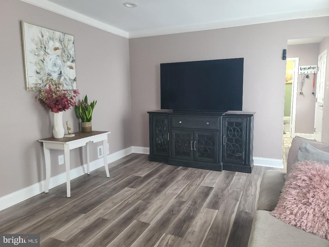 7834 Citadel Drive Severn, MD 21144 - Photo 28 of 58 a living room with furniture and a flat screen tv