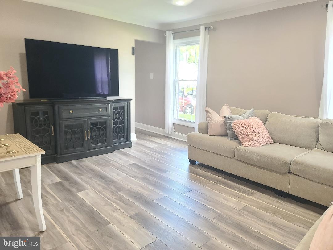 7834 Citadel Drive Severn, MD 21144 - Photo 44 of 58 a living room with furniture and a flat screen tv