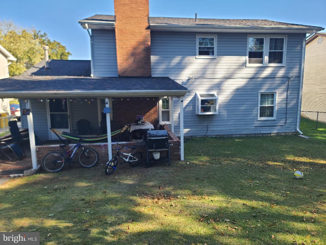 7834 Citadel Drive Severn, MD 21144 - Photo 53 of 58 a view of a house with a barbeque and wooden deck