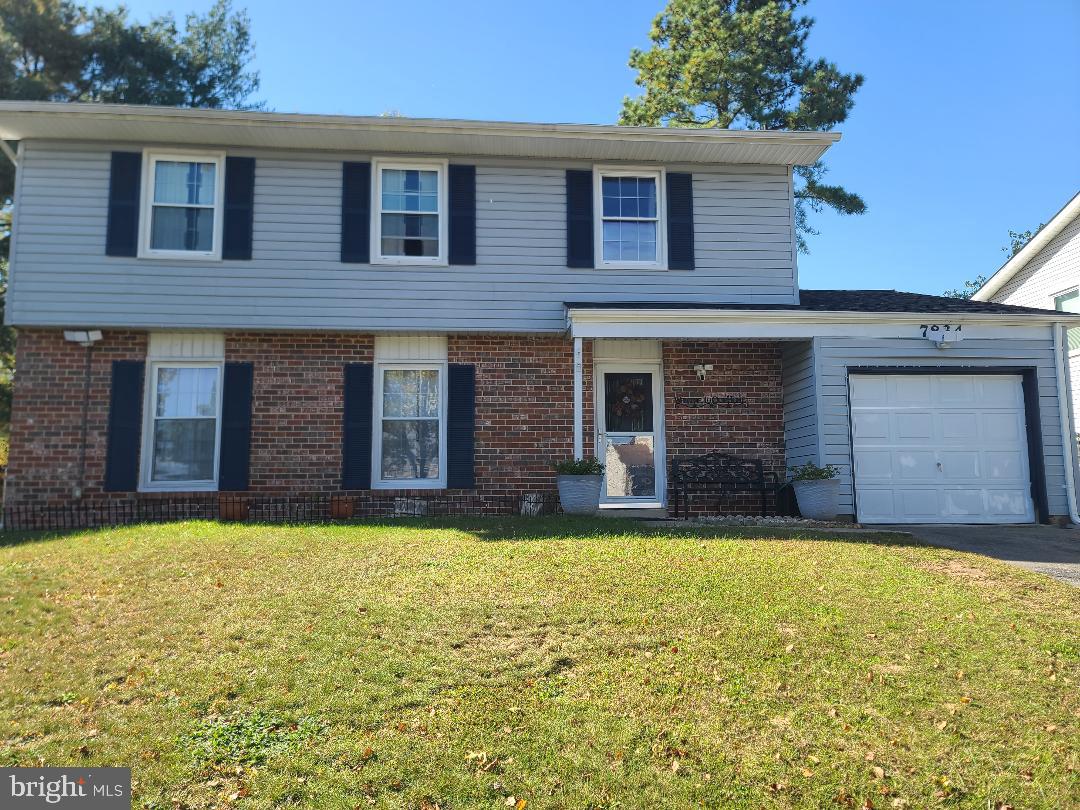 7834 Citadel Drive Severn, MD 21144 - Photo 57 of 58 a brick house with a yard in front of it