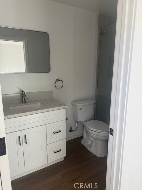 425 West Lime Avenue, Unit 1 Monrovia, CA 91016 - Photo 15 of 31 a bathroom with a sink a toilet a vanity and mirror