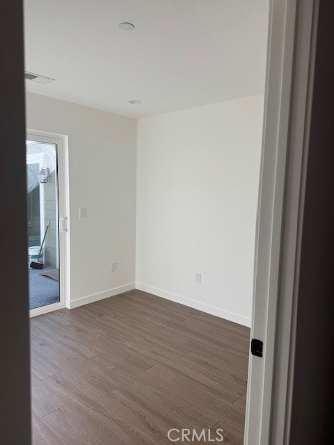 425 West Lime Avenue, Unit 1 Monrovia, CA 91016 - Photo 16 of 31 a view of an empty room with wooden floor