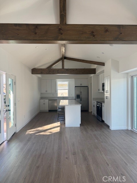 425 West Lime Avenue, Unit 1 Monrovia, CA 91016 - Photo 6 of 31 a view of a livingroom with wooden floor and kitchen