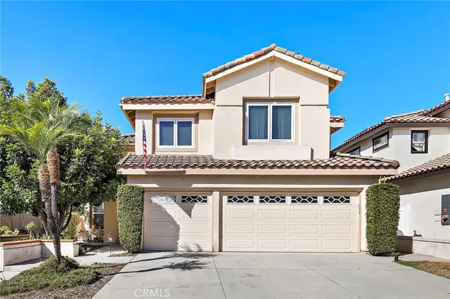 a front view of a house with a garage