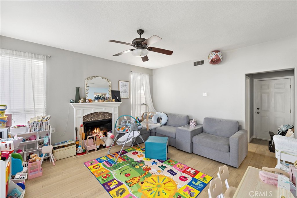 43 El Prisma Rancho Santa Margarita, CA 92688 - Photo 15 of 36 a living room with furniture and a fireplace