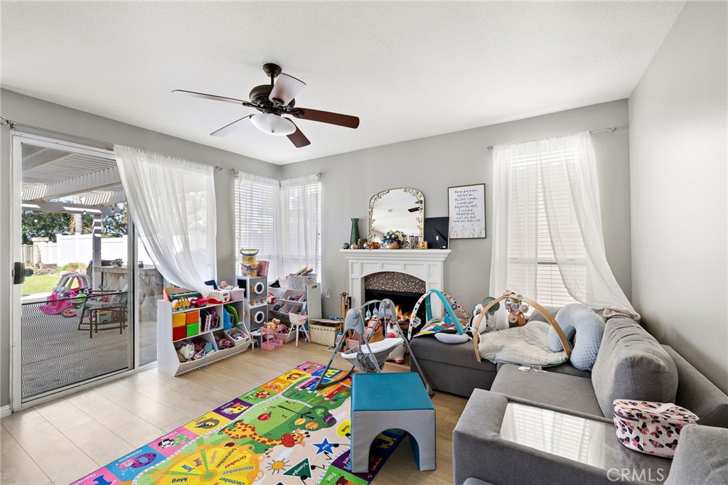 43 El Prisma Rancho Santa Margarita, CA 92688 - Photo 16 of 36 a living room with furniture and a baby crib