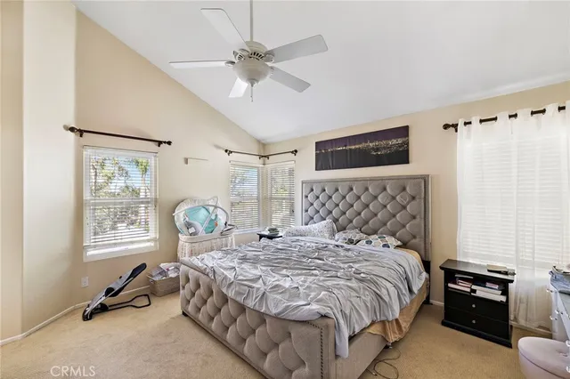 a bedroom with a bed and flat screen tv