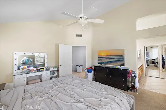 a bathroom with a tub a sink and a large mirror