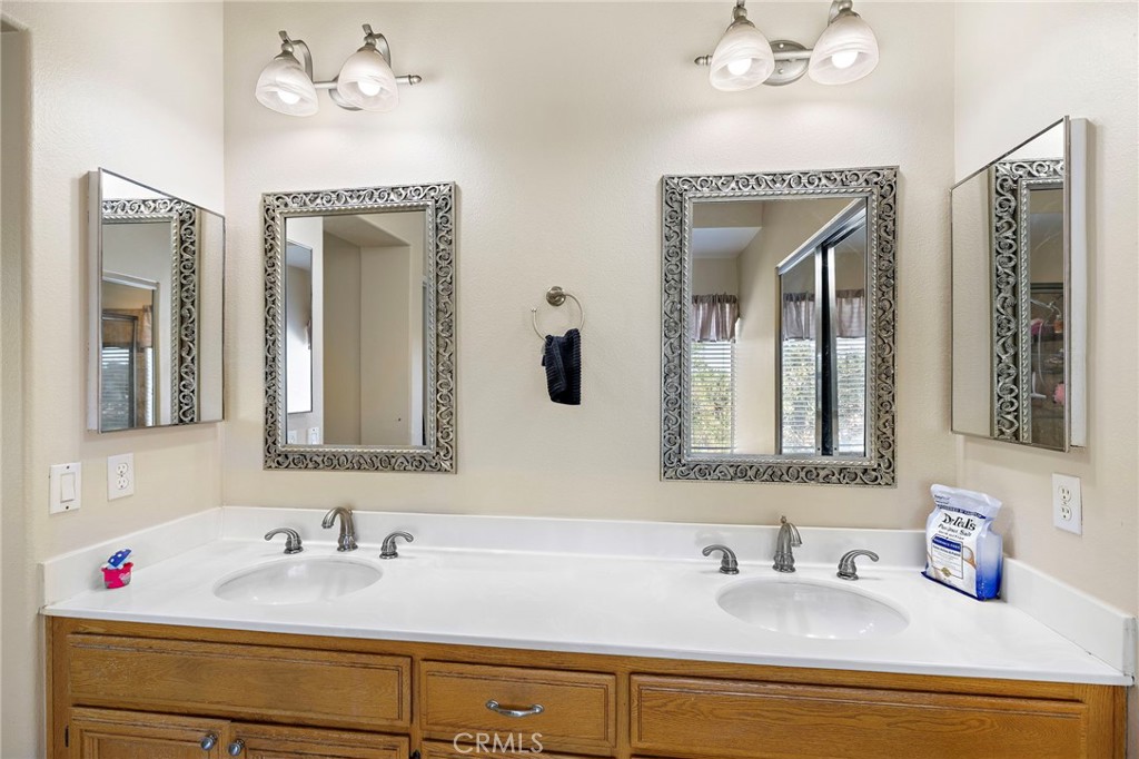 43 El Prisma Rancho Santa Margarita, CA 92688 - Photo 27 of 36 a bathroom with a sink and a mirror