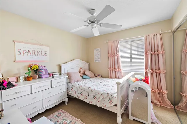 a bedroom with furniture and white walls