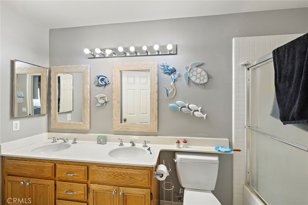 43 El Prisma Rancho Santa Margarita, CA 92688 - Photo 31 of 36 a bathroom with a sink a toilet and a mirror