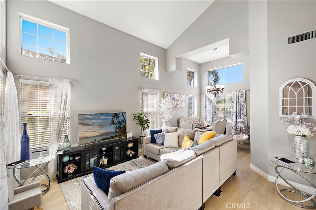 43 El Prisma Rancho Santa Margarita, CA 92688 - Photo 6 of 36 a living room with furniture and a flat screen tv