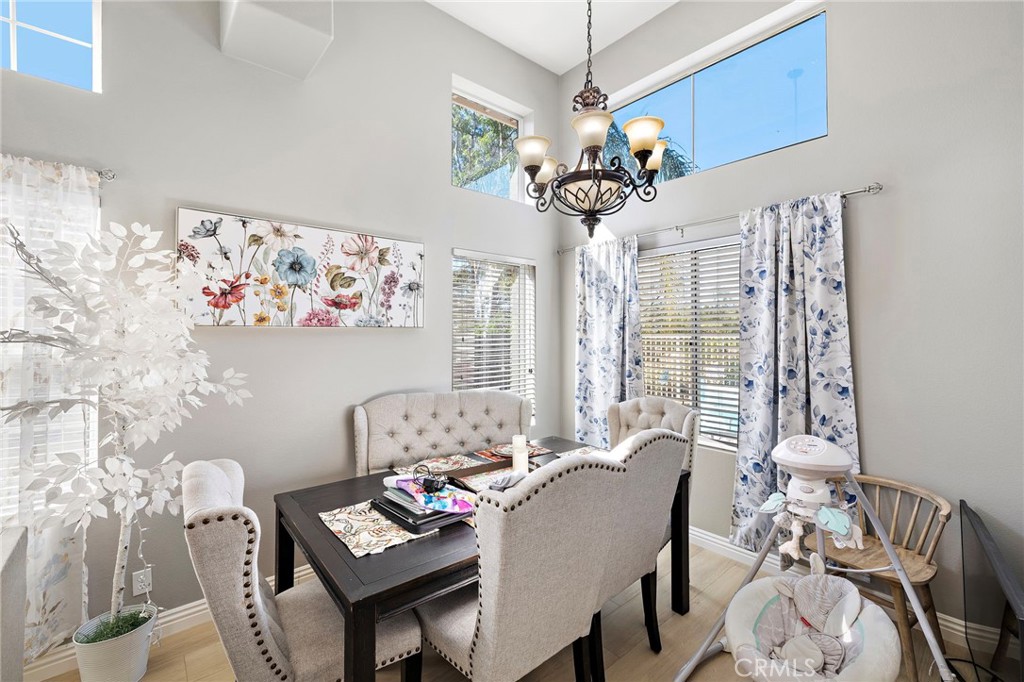43 El Prisma Rancho Santa Margarita, CA 92688 - Photo 8 of 36 a view of a dining room with furniture wooden floor and chandelier