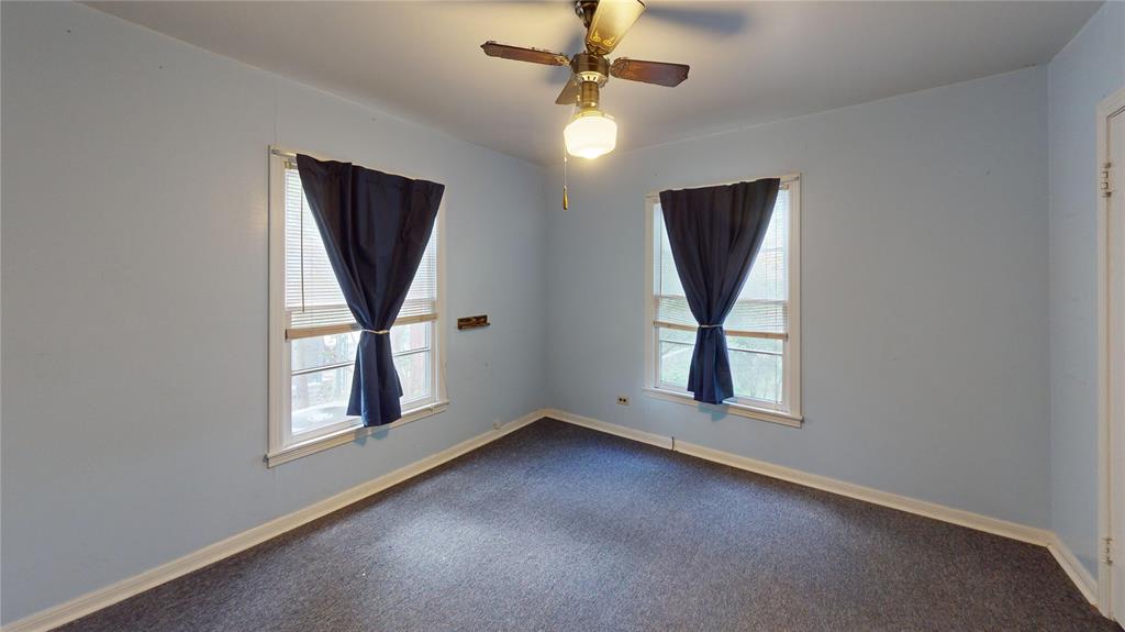 3125 McFerrin Avenue Waco, TX 76708 - Photo 31 of 36 Carpeted empty room with plenty of natural light and a ceiling fan