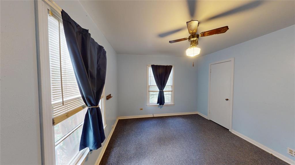 3125 McFerrin Avenue Waco, TX 76708 - Photo 33 of 36 Empty room featuring healthy amount of natural light, carpet floors, and a ceiling fan