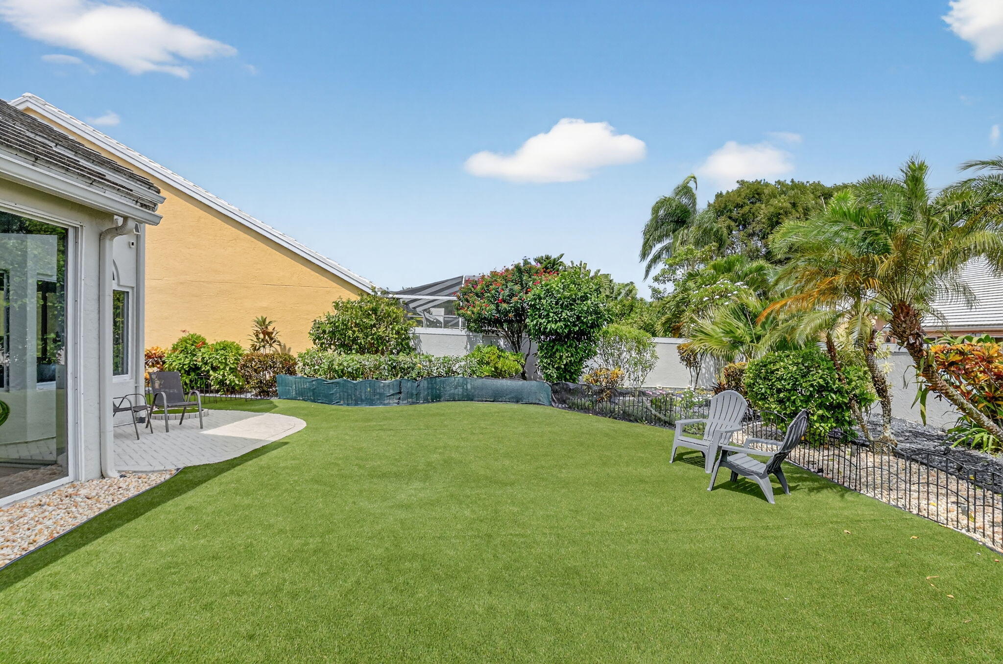 8385 Horseshoe Bay Road Boynton Beach, FL 33472 - Photo 29 of 49 a view of a backyard with a garden