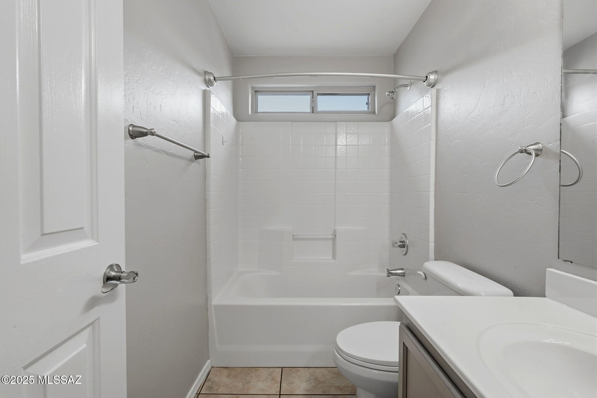 8244 South Lost Mountain Road Tucson, AZ 85747 - Photo 31 of 41 a bathroom with a bathtub toilet and a shower