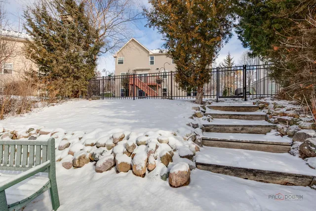 a view of a house with a snow in the yard