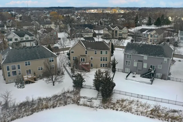 a backyard of a house with lots of green space and trees