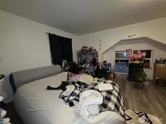 a bed room with a bed furniture and a tv