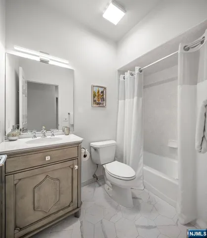 a spacious bathroom with a double vanity sink mirror and