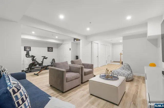 a view of a livingroom with workspace and a window