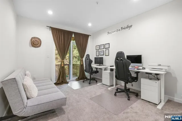 a living room with furniture wooden floor and a flat screen tv