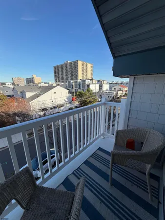 a view of a balcony with furniture