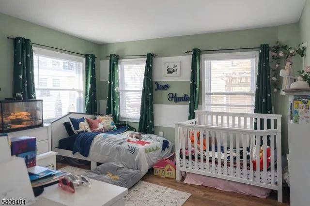 a bedroom with furniture and a window