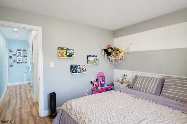 a bedroom with a bed and a table