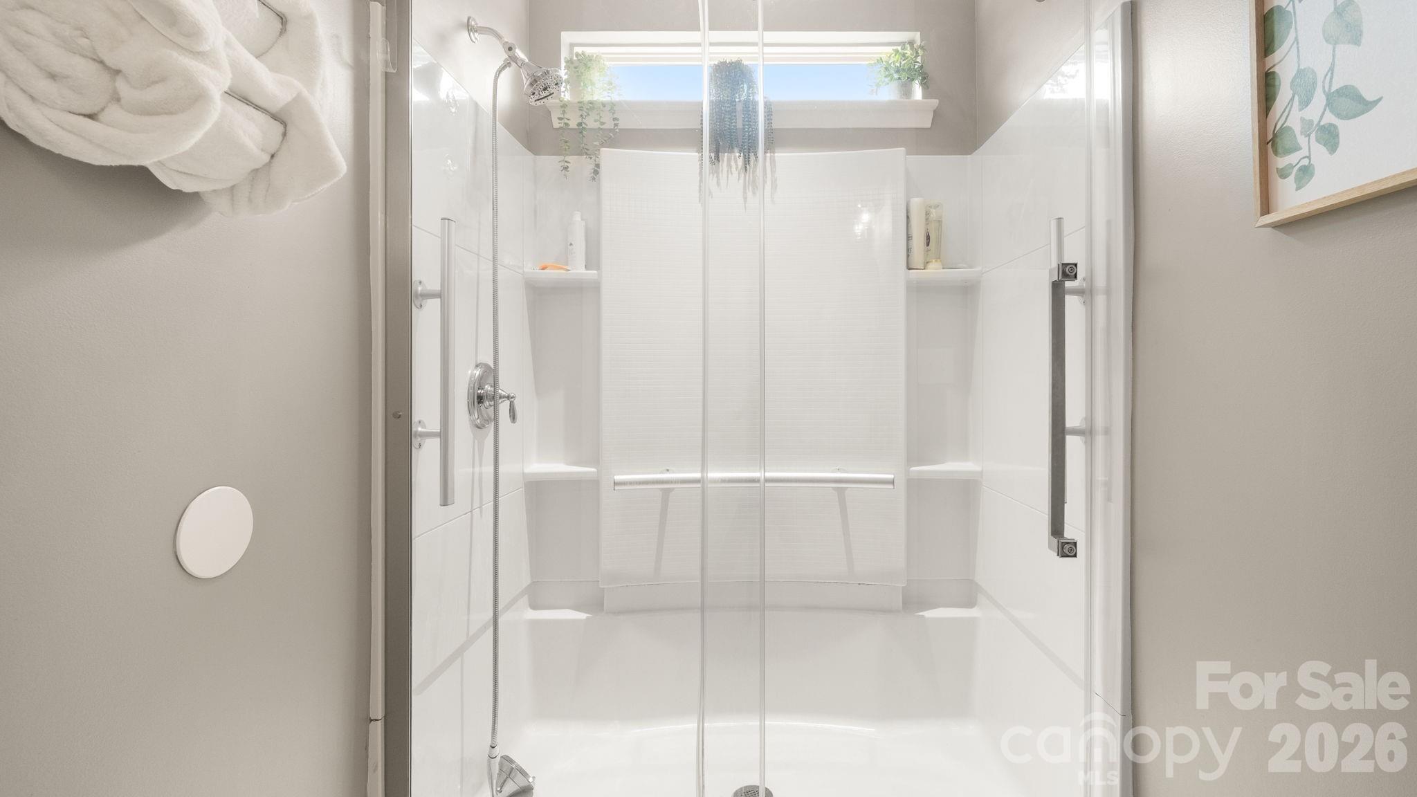 4708 Summerside Drive Clover, SC 29710 - Photo 12 of 48 a bathroom with a glass shower door