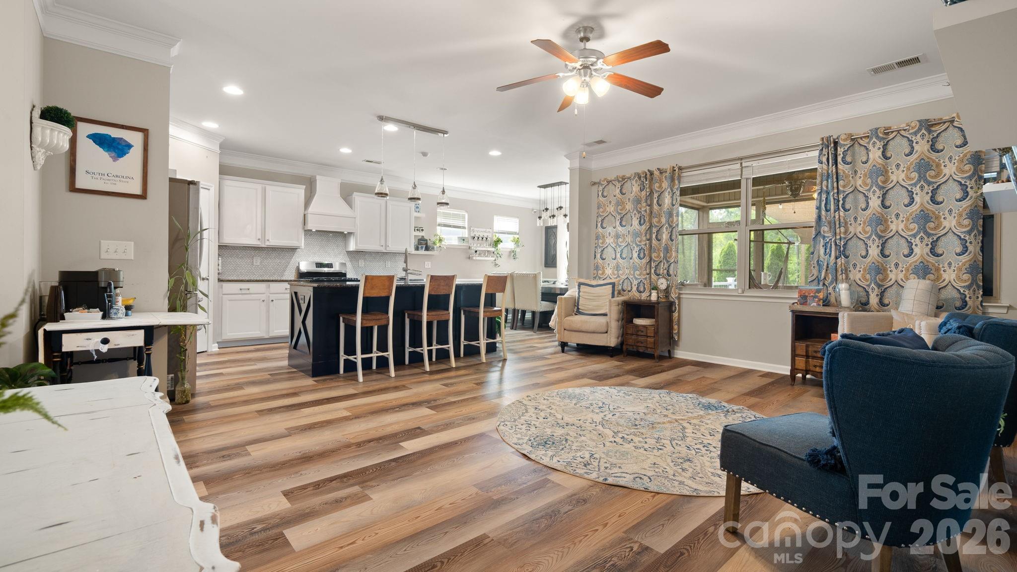 4708 Summerside Drive Clover, SC 29710 - Photo 15 of 48 a living room with furniture a dining table and a flat screen tv