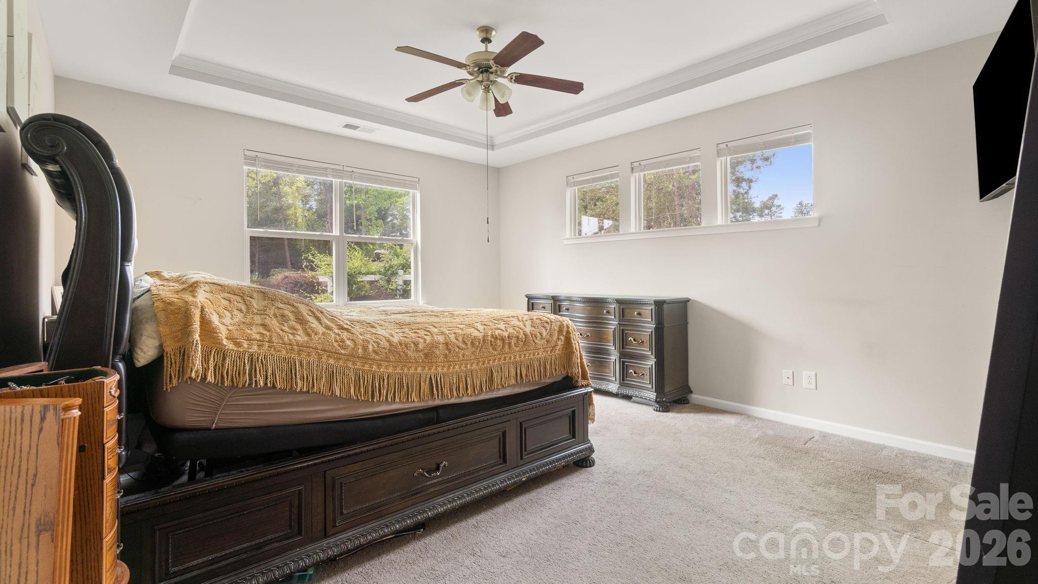 4708 Summerside Drive Clover, SC 29710 - Photo 24 of 48 a bedroom with a bed and a flat tv screen on the dresser