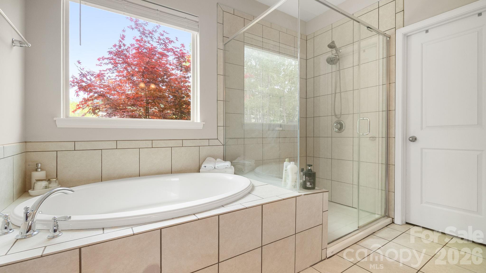4708 Summerside Drive Clover, SC 29710 - Photo 26 of 48 a bathroom with a white bath tub and a shower