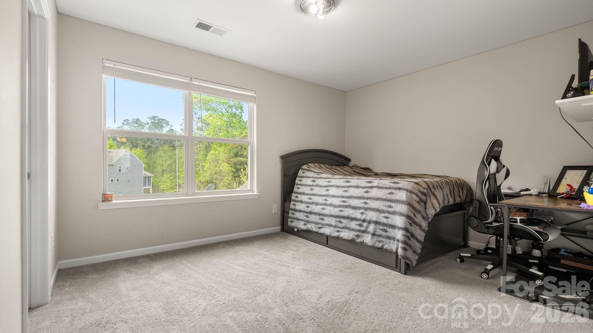 4708 Summerside Drive Clover, SC 29710 - Photo 31 of 48 a bedroom with a bed and a window