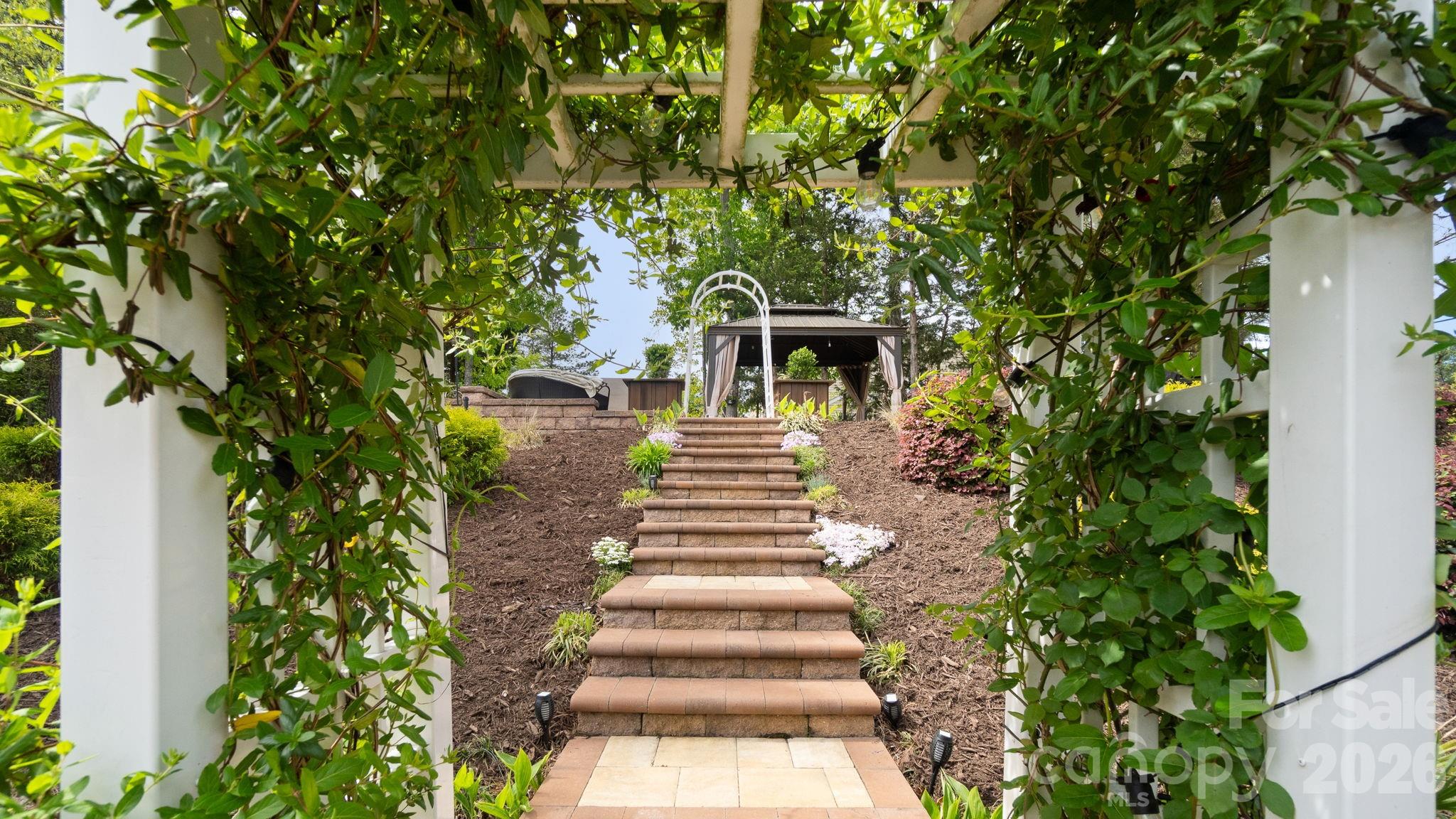 4708 Summerside Drive Clover, SC 29710 - Photo 35 of 48 a view of a yard with plants and a fountain