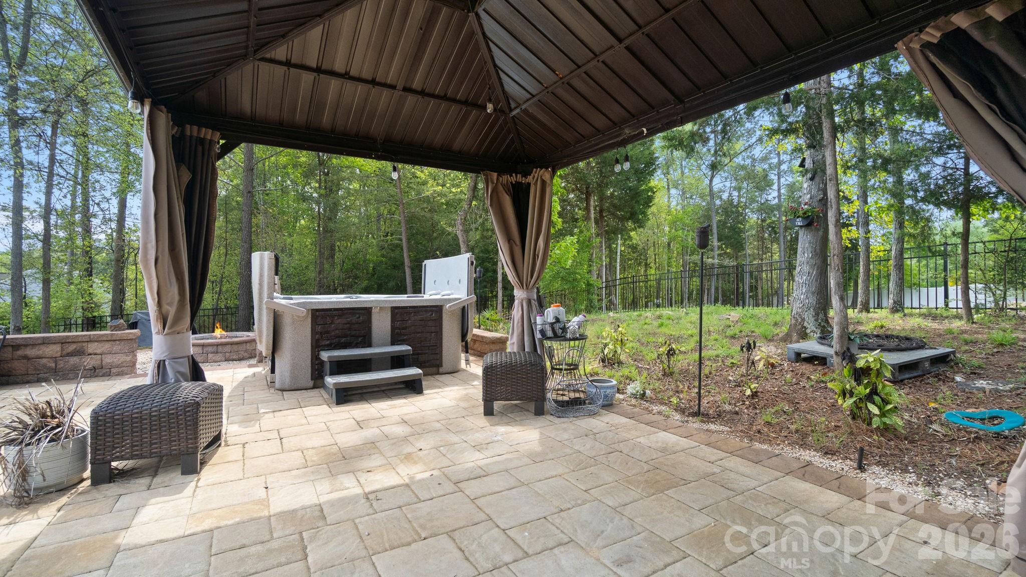 4708 Summerside Drive Clover, SC 29710 - Photo 37 of 48 a view of a patio with chairs and floor to ceiling window
