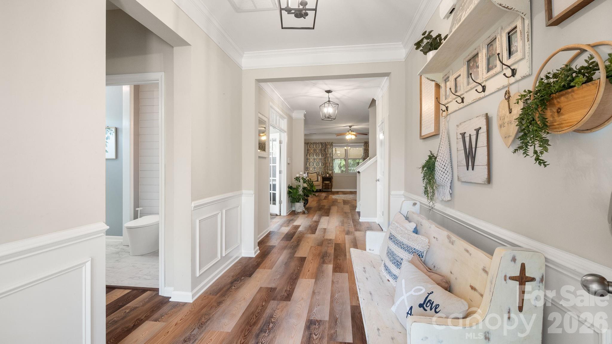4708 Summerside Drive Clover, SC 29710 - Photo 5 of 48 a view of a hallway with wooden floor and staircase