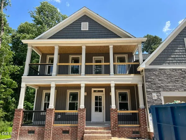 a front view of a house with glass windows