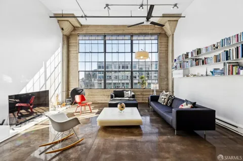 a living room with furniture fireplace and a flat screen tv