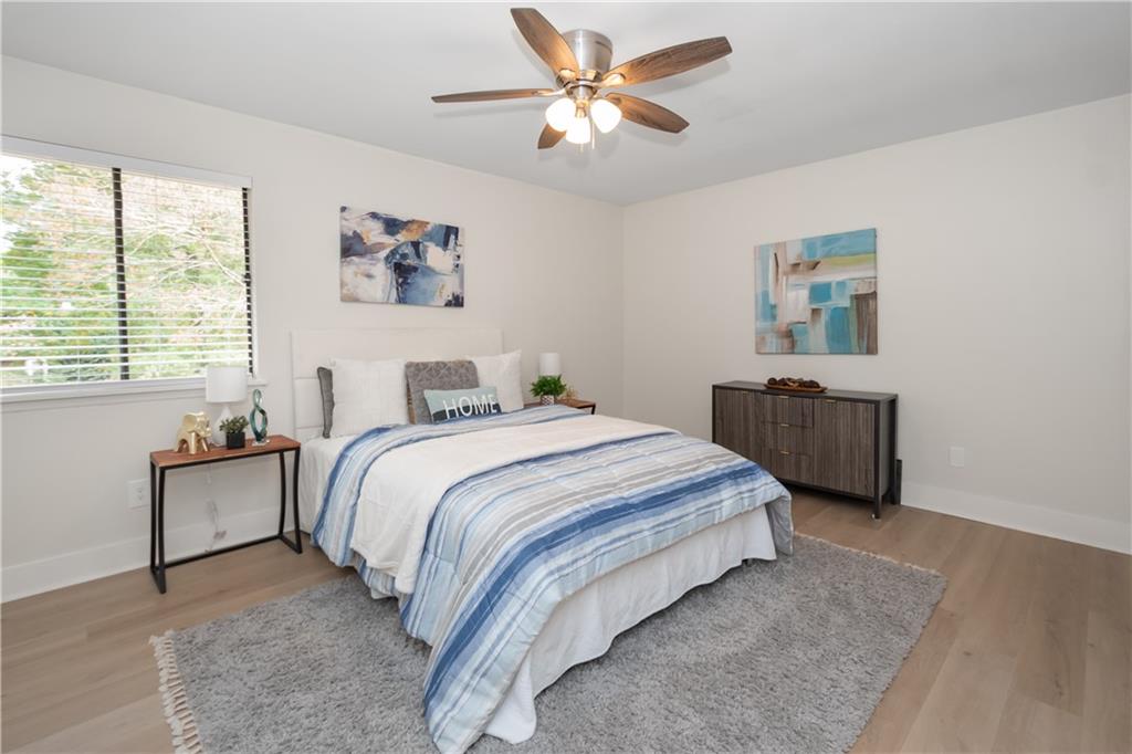 2432 Mistletoe Lane Southwest Snellville, GA 30039 - Photo 17 of 42 a bedroom with a bed and a window