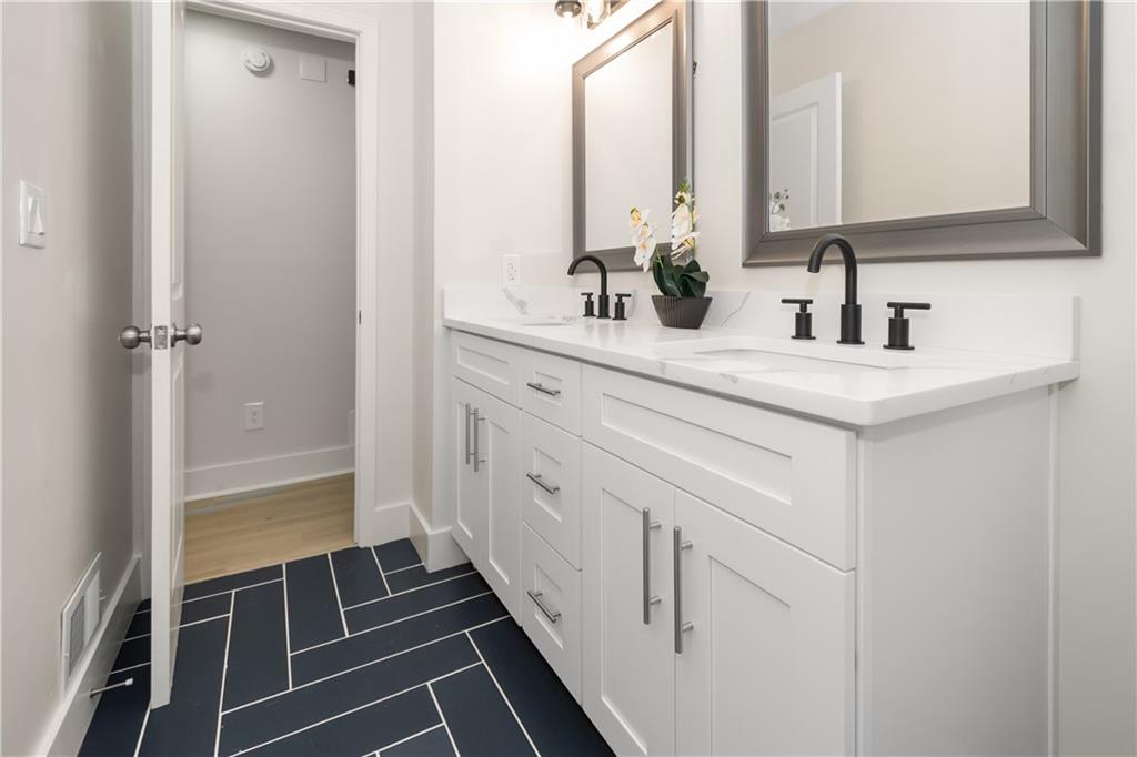 2432 Mistletoe Lane Southwest Snellville, GA 30039 - Photo 20 of 42 a bathroom with a sink and a mirror