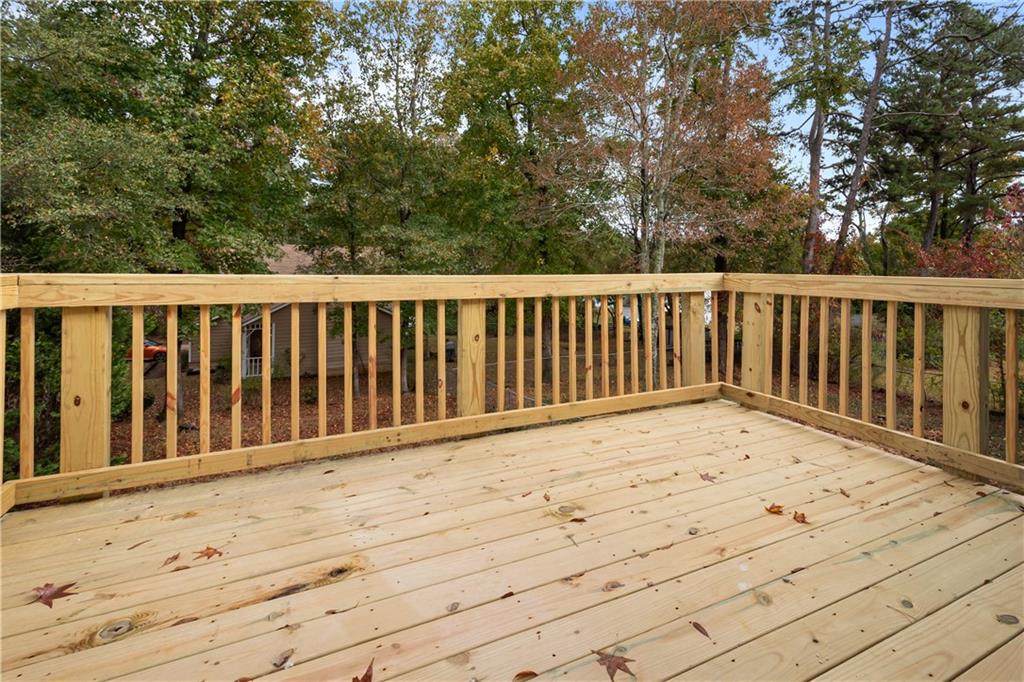 2432 Mistletoe Lane Southwest Snellville, GA 30039 - Photo 38 of 42 a view of balcony with wooden floor and fence