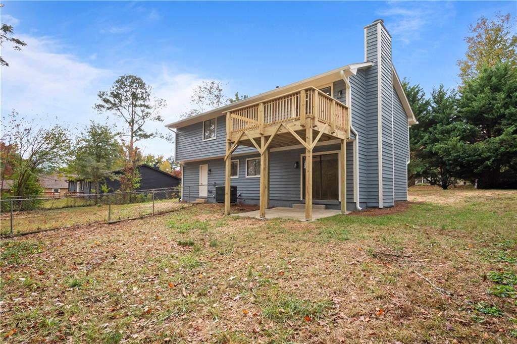 2432 Mistletoe Lane Southwest Snellville, GA 30039 - Photo 41 of 42 a view of a house with a yard