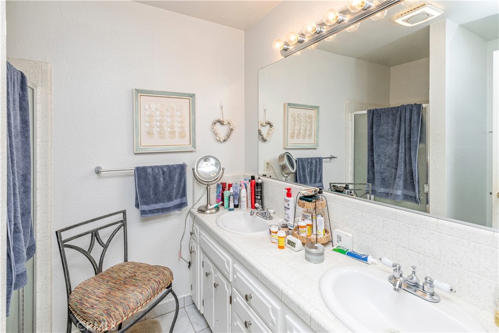 3552 Wathen Court Merced, CA 95348 - Photo 9 of 14 a bathroom with a sink vanity tub and a mirror
