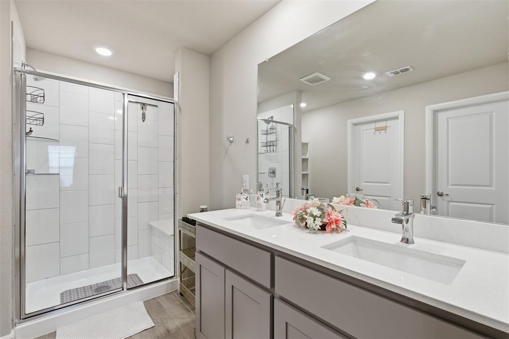 333 Alice Harney Road Burleson, TX 76028 - Photo 11 of 36 a bathroom with double sink and a mirror