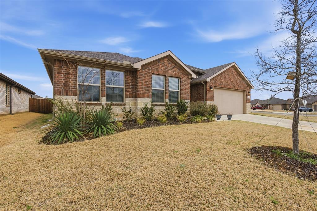 333 Alice Harney Road Burleson, TX 76028 - Photo 16 of 36 a front view of a house with a yard
