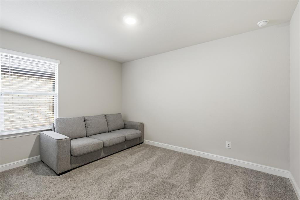 333 Alice Harney Road Burleson, TX 76028 - Photo 22 of 36 a living room with furniture and a window
